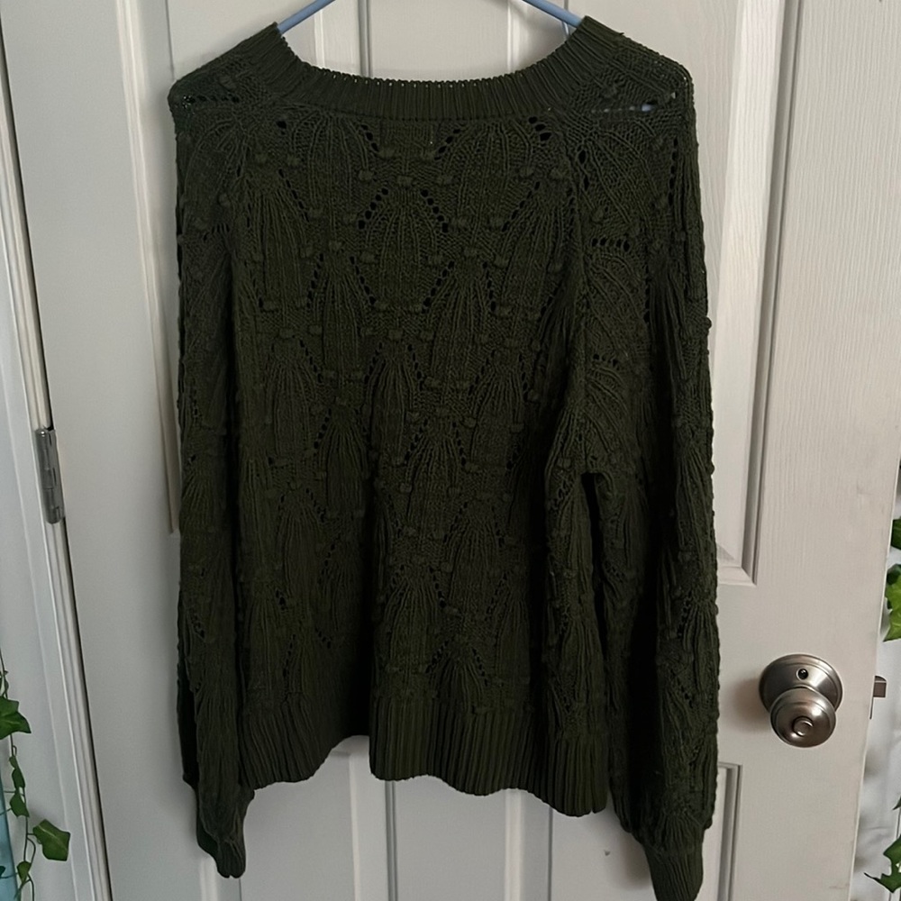 Francesca’s small green sweater